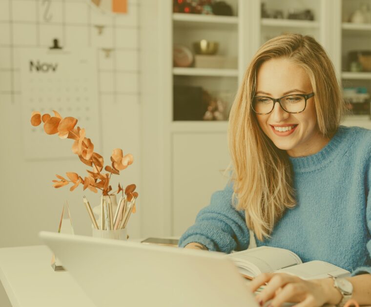Woman Smiling at Computer Gold 1