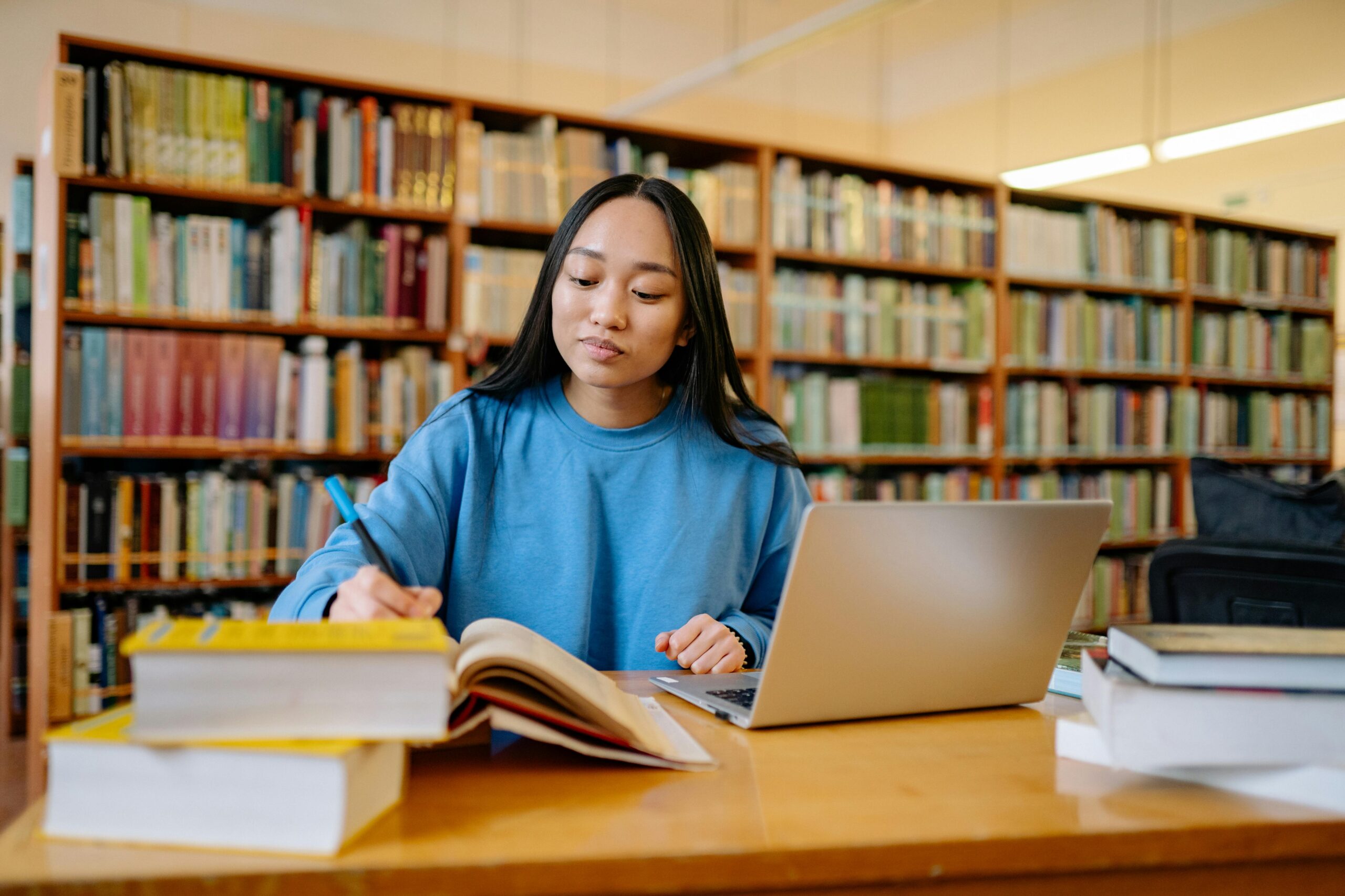Student Studying in Library scaled